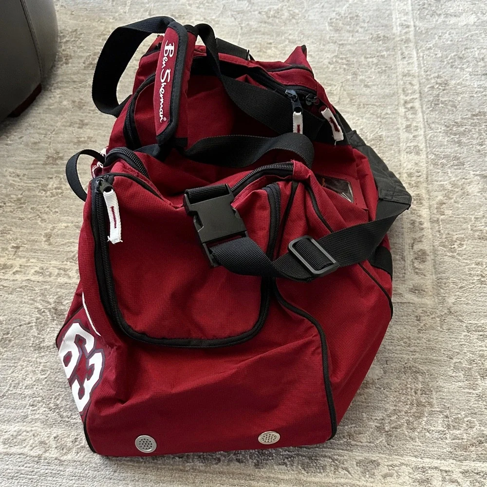 Ben Sherman Burgundy Duffel Bag with Black Accents.